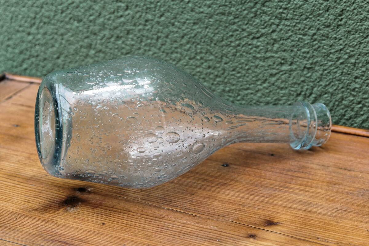 Biot blown glass bottle