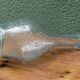 Biot blown glass bottle