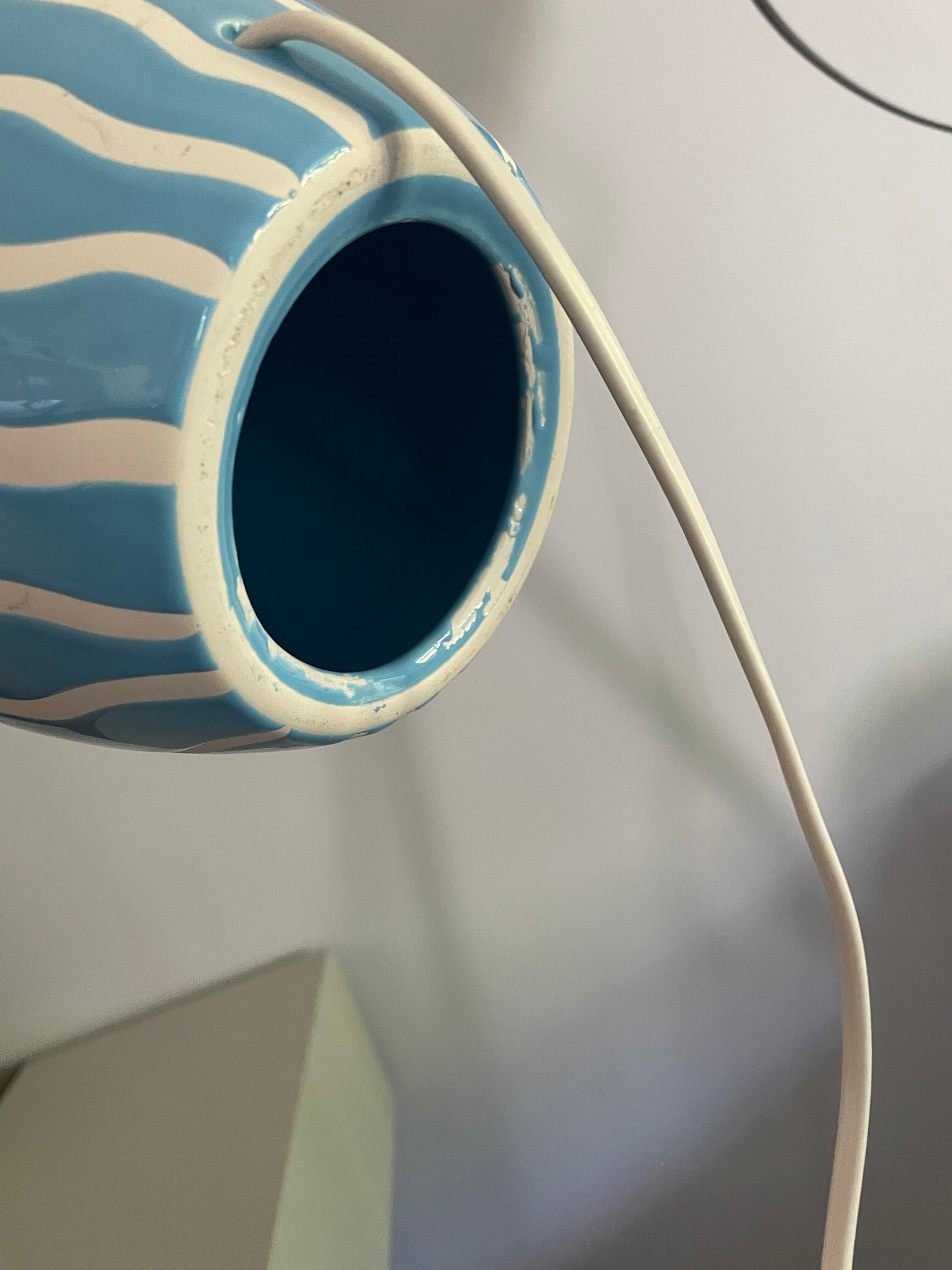 Blue ceramic lamp and rattan