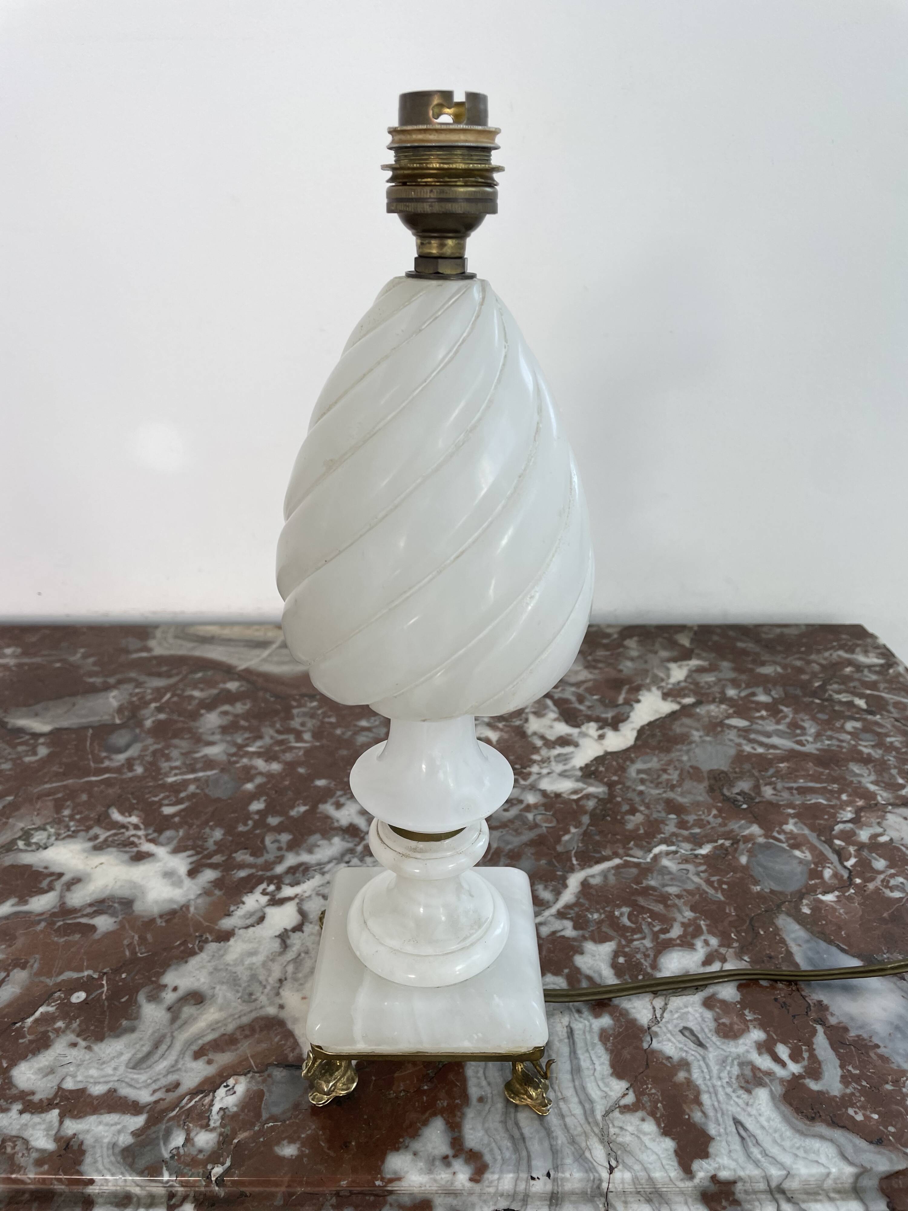 Alabaster lamp, twisted, gadroon decoration, gilded brass base, dolphins