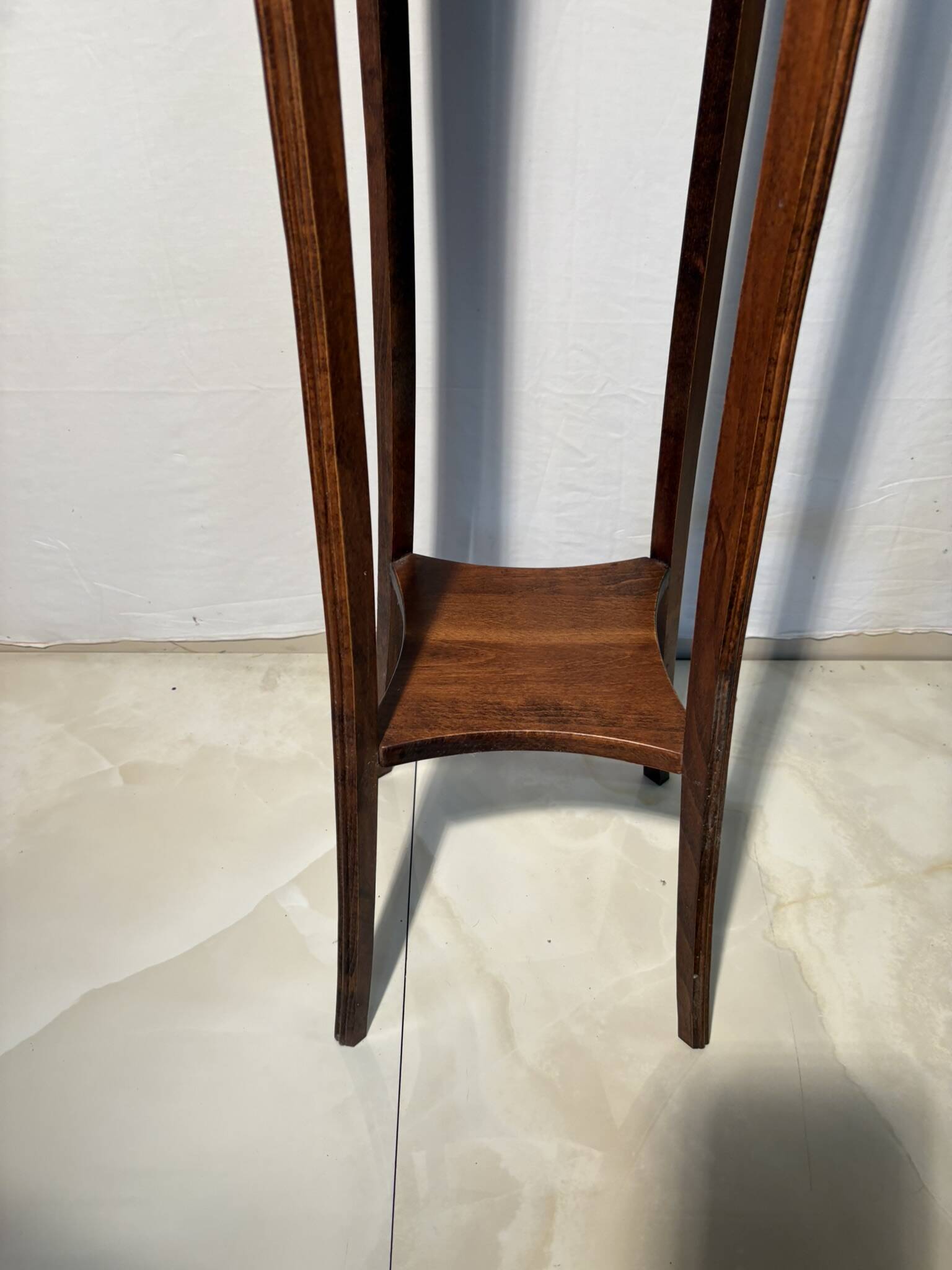 Vintage dark wood side table with curved base
