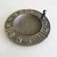 Luxa brass ashtray with zodiac relief and embers killer