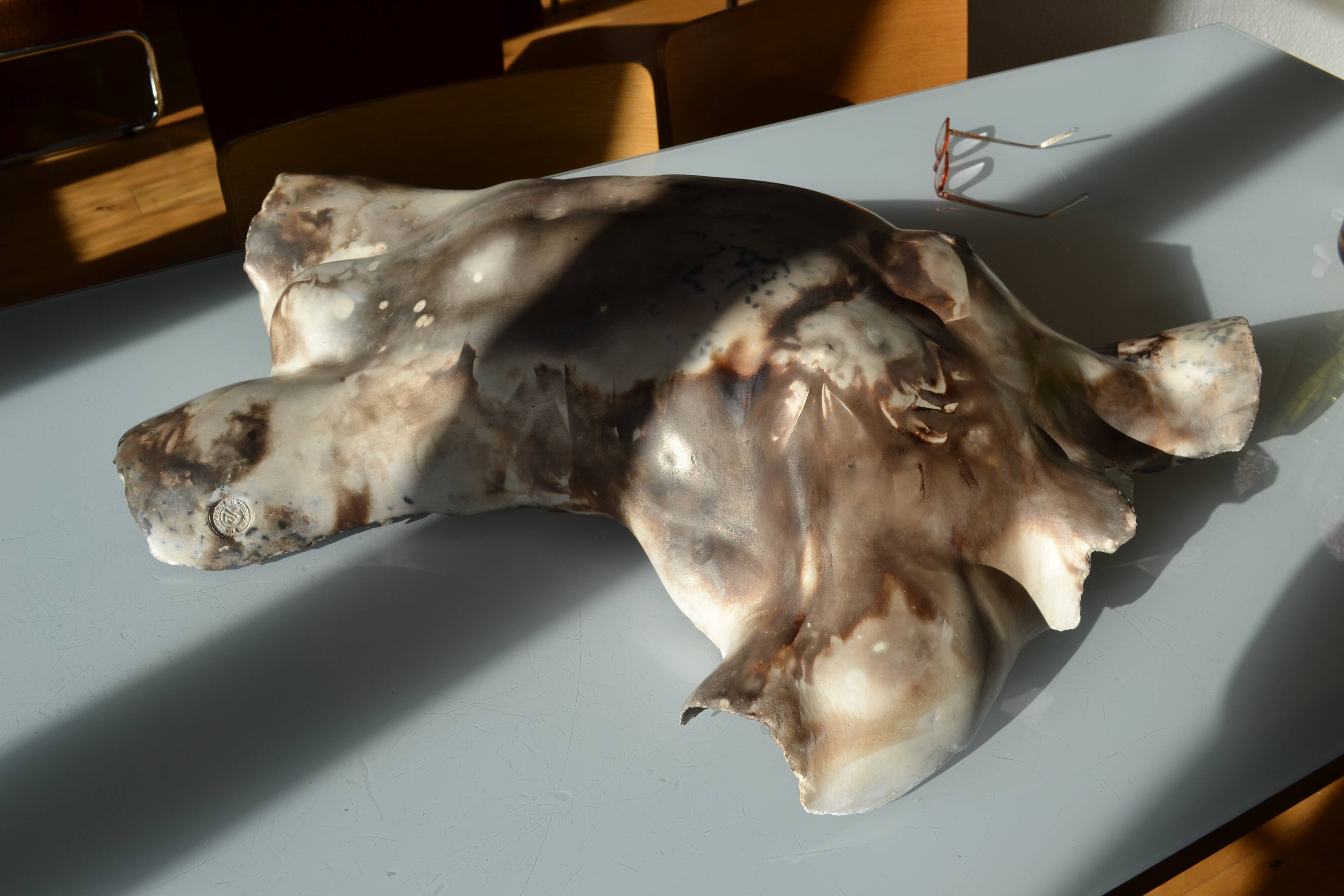 Male torso sculpture by patinated casting, signed to be identified.