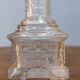 Vendôme column perfume bottle in moulded glass, 19th century.