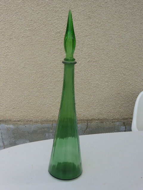Vintage green faceted glass bottle with its cap 1970