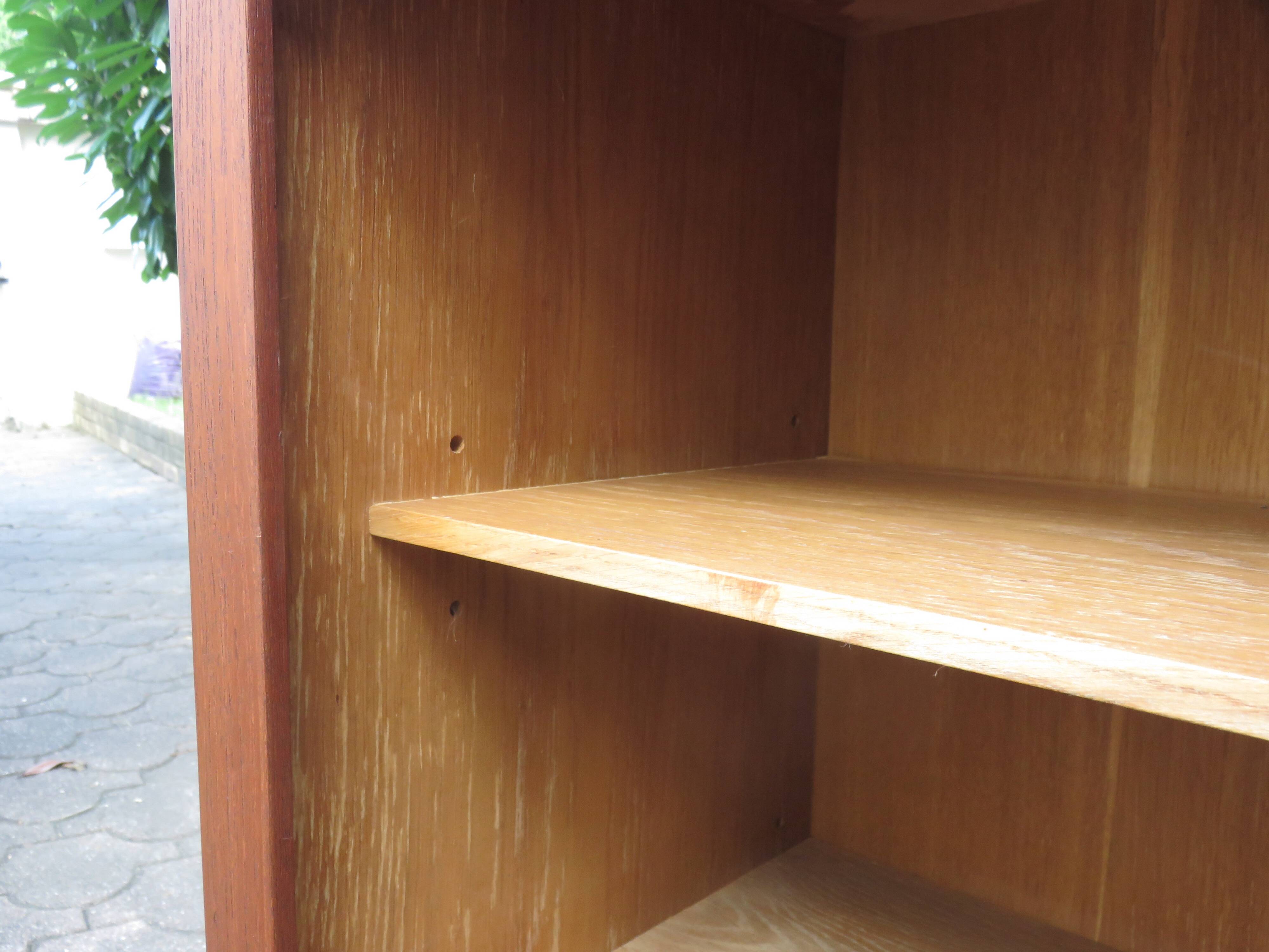 Low sideboard with 3 sliding doors in teak. Denmark 1960