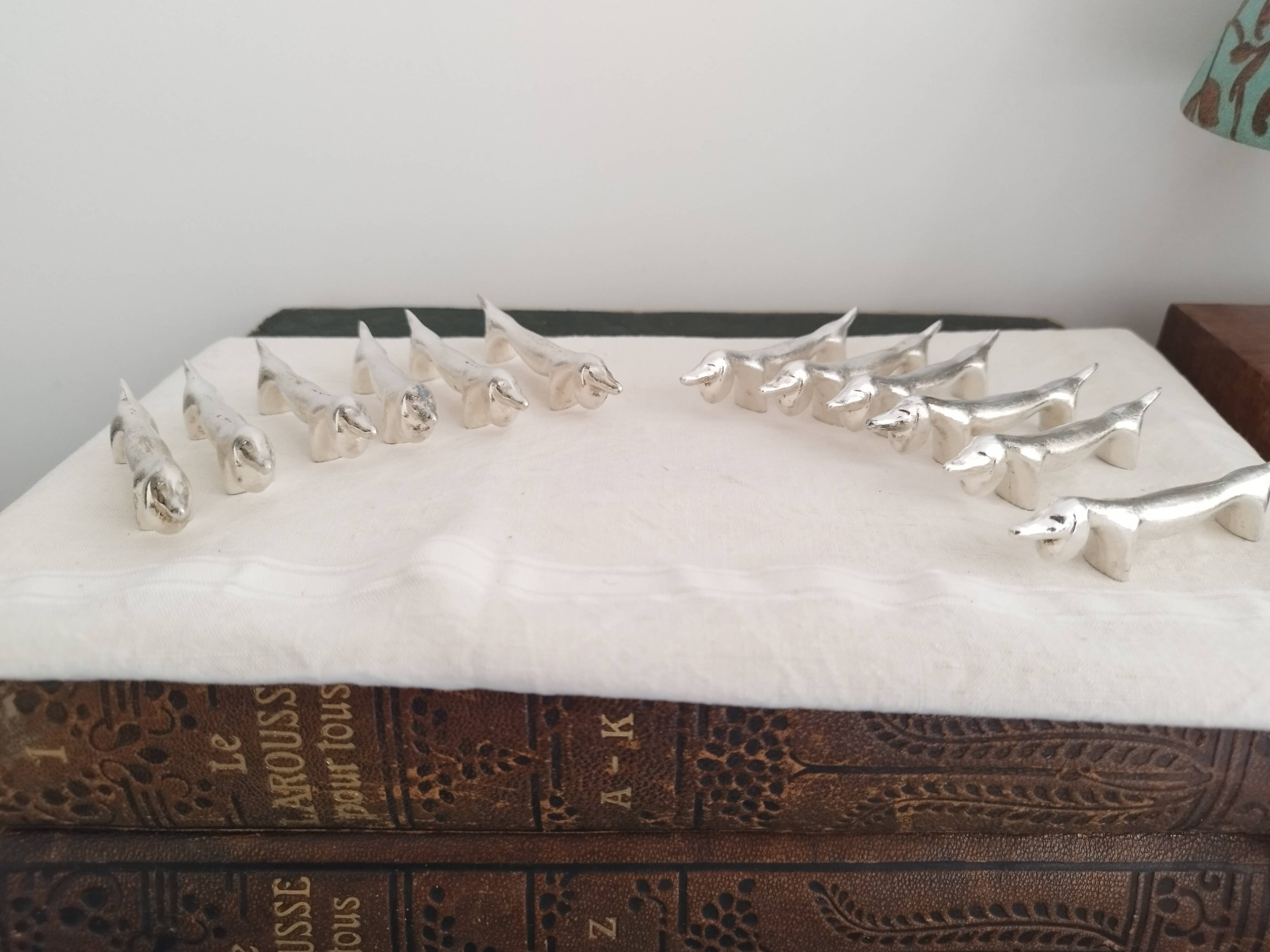 Silver metal knife holders with Dachshund dogs