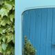 Beveled mirror on turquoise Parisian door