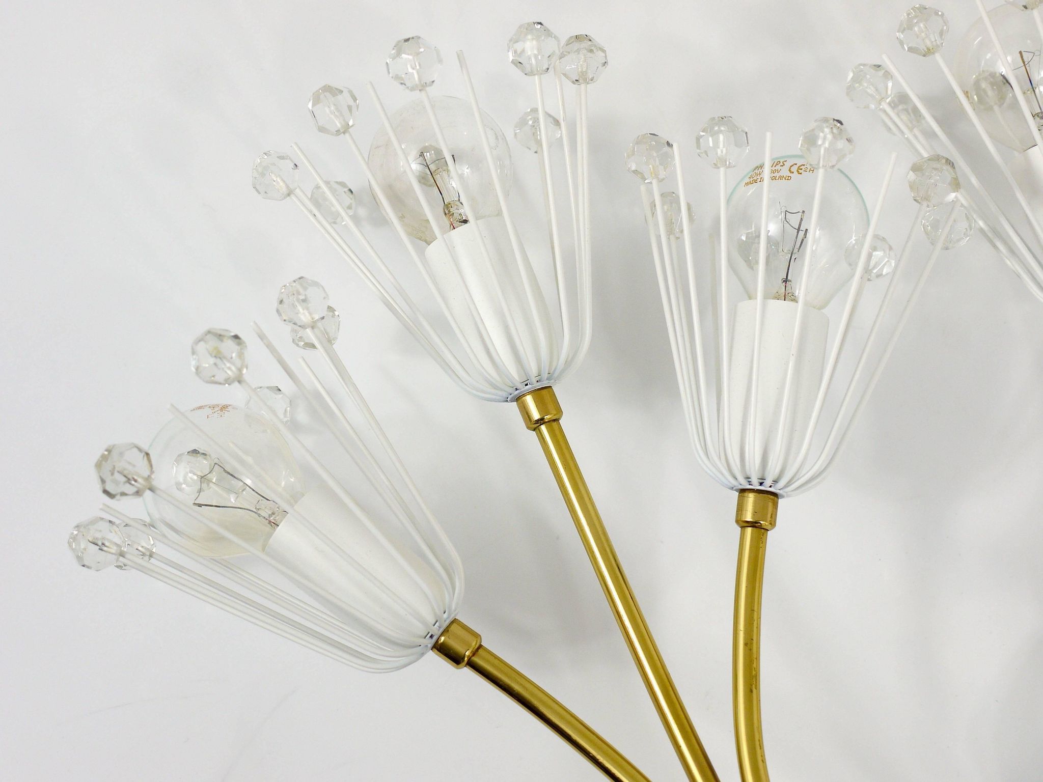Pair of mid-century wall sconces in brass with flowers, Emil Stejnar, Rupert Nikoll, Austria, 1950s.
