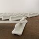 Vintage knife holders of 12, in white wave-shaped porcelain