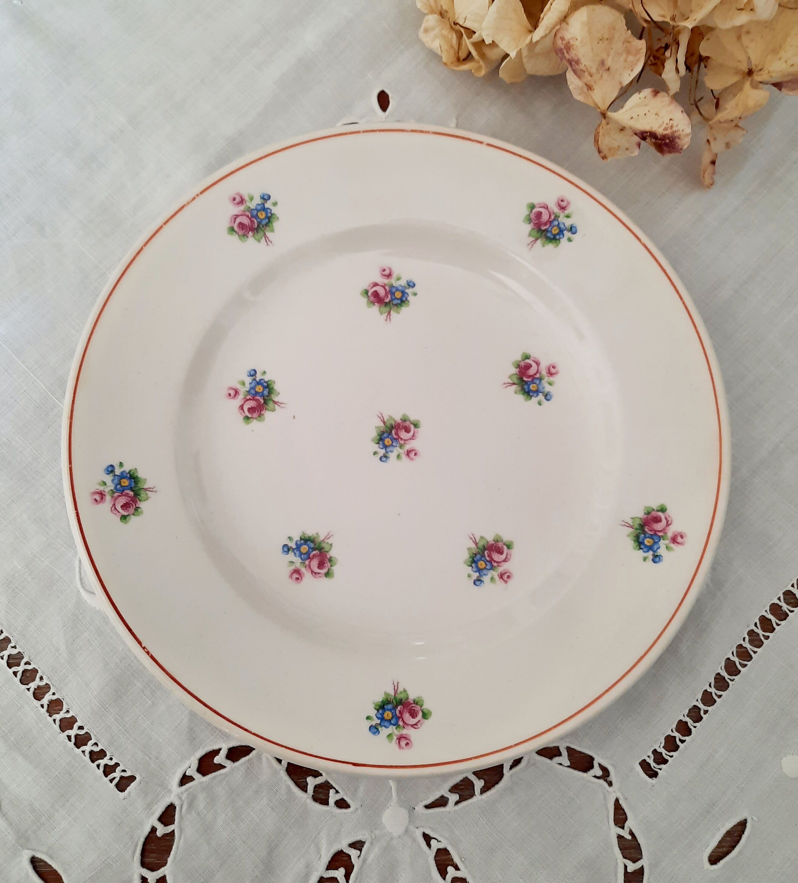 7 mismatched antique dessert plates accompanied by a pie dish