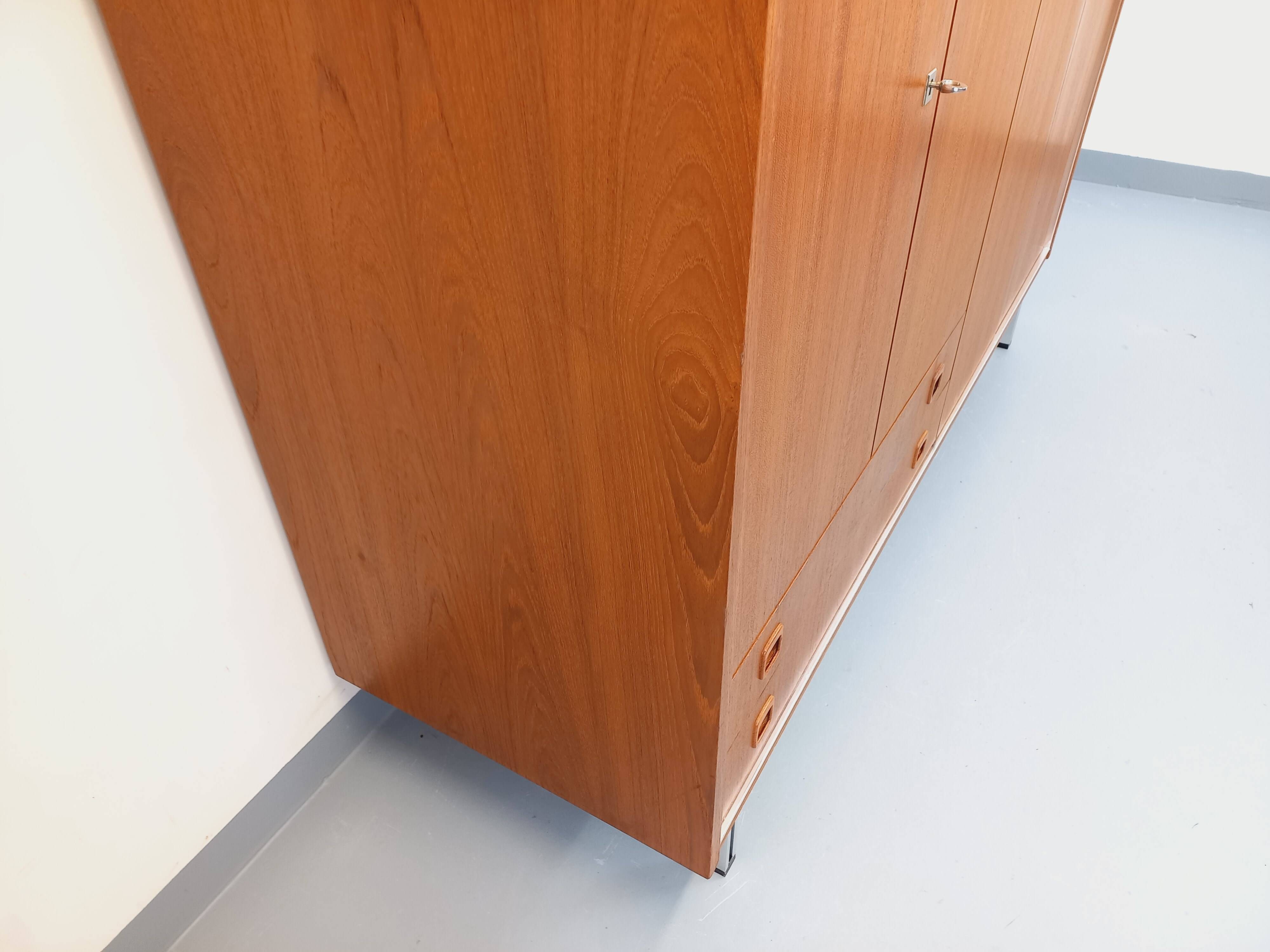 Vintage Scandinavian modernist wardrobe in teak and metal from the 1960s.