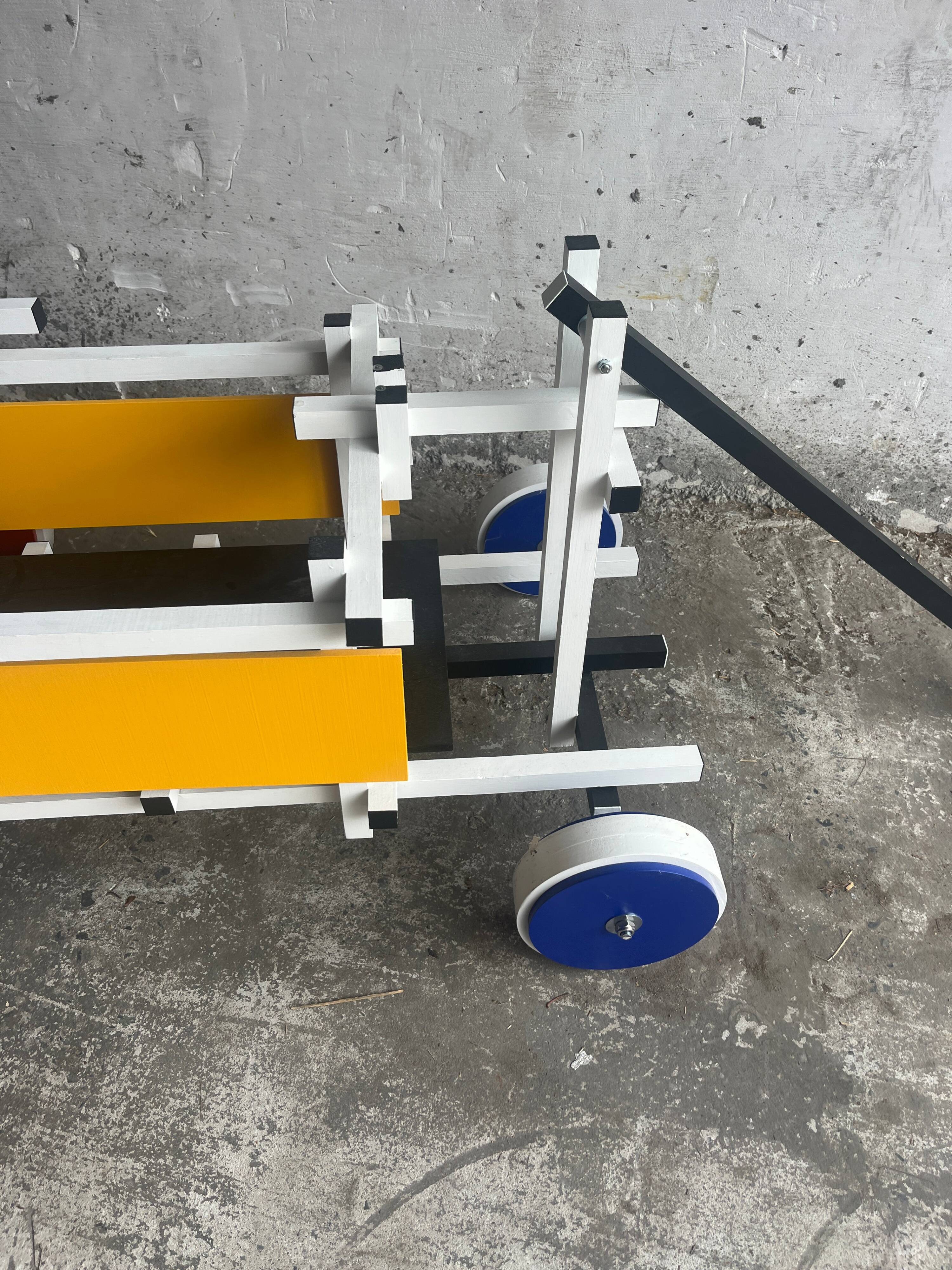 Rietveld-style De Stijl handcart in painted wood — white frame with red, blue, yellow accents