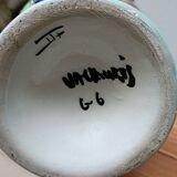 Vallauris vase flowers on black background