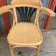 Pair of curved wooden bistro chairs with armrests