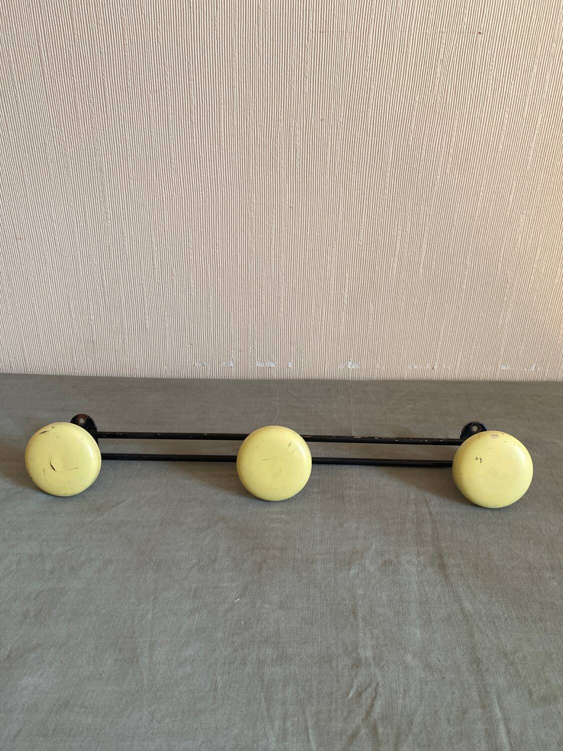 2 black and yellow metal wall coat racks