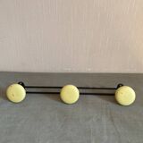 2 black and yellow metal wall coat racks