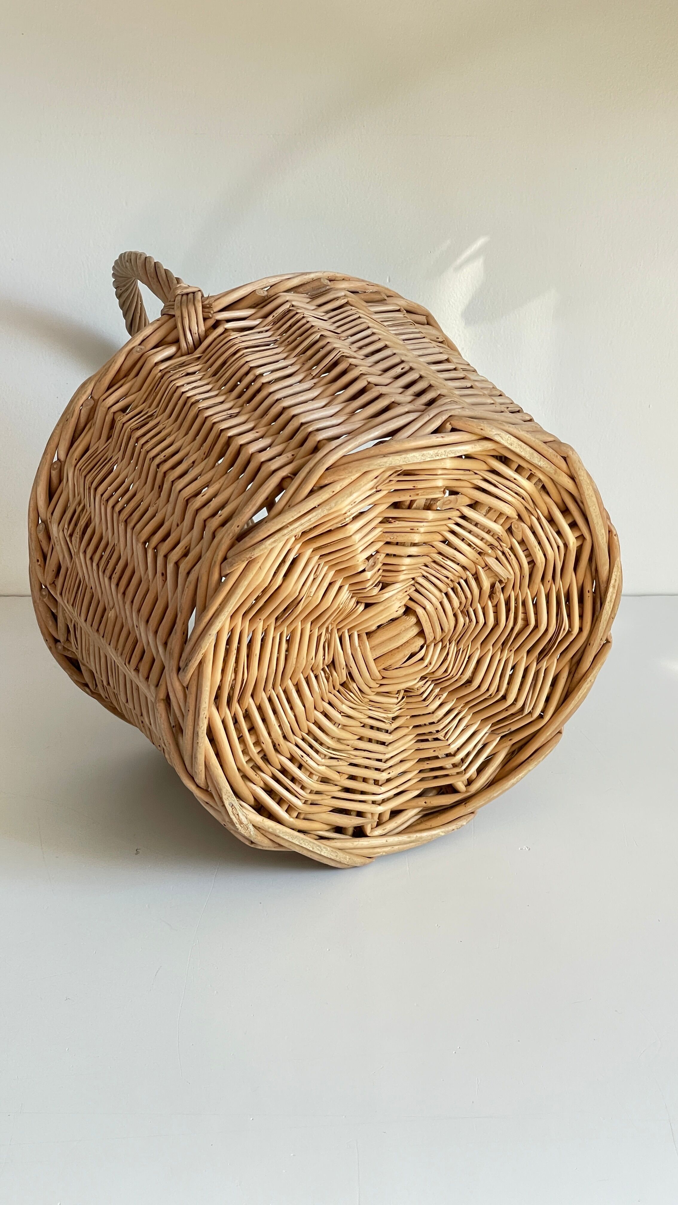 Basket with vintage rattan bottles