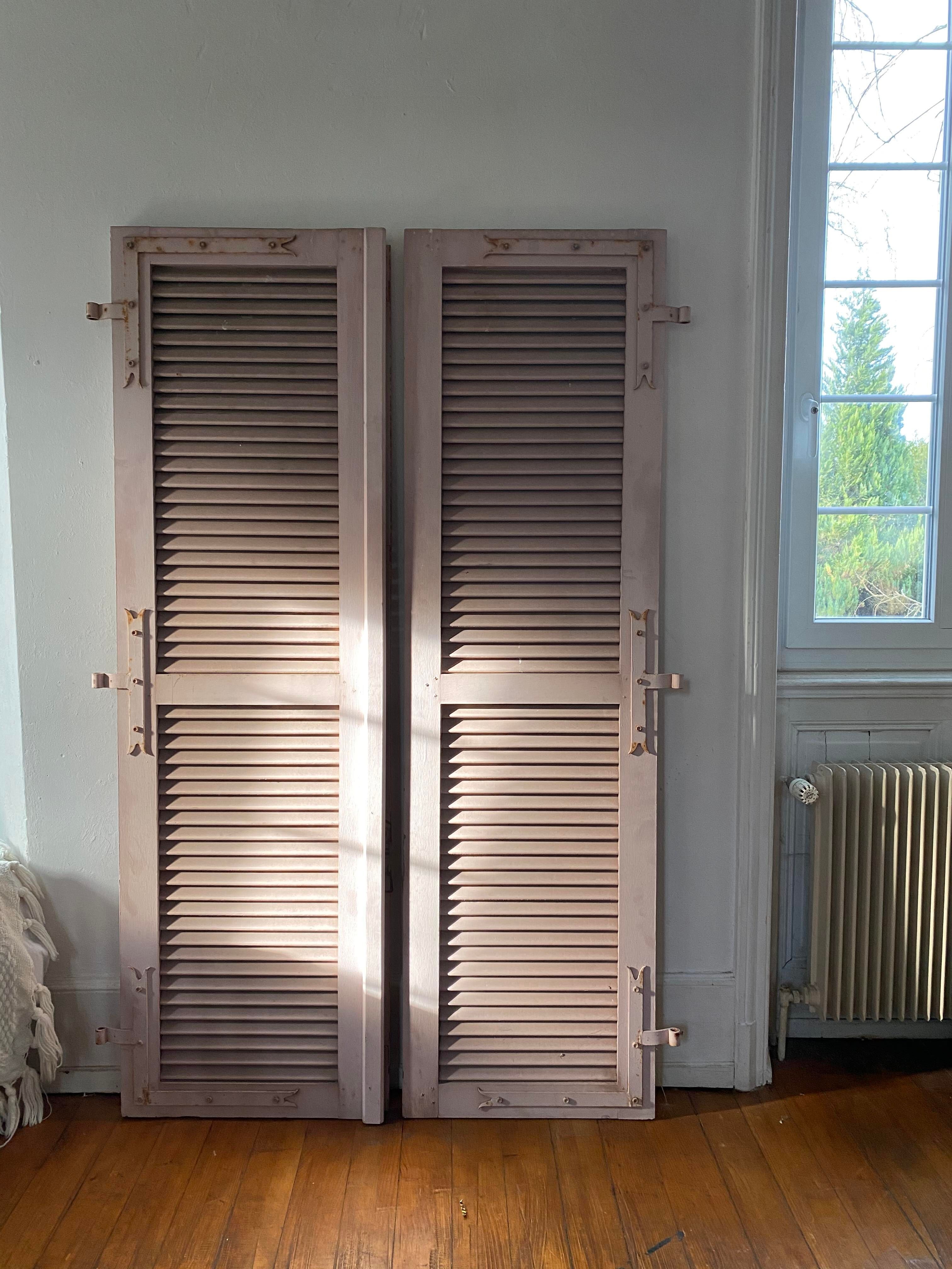 Pair of shutters with wooden shutters in old pink color