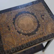 Decorated antique side table with elephant