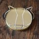Antique round barber mirror in gilded metal