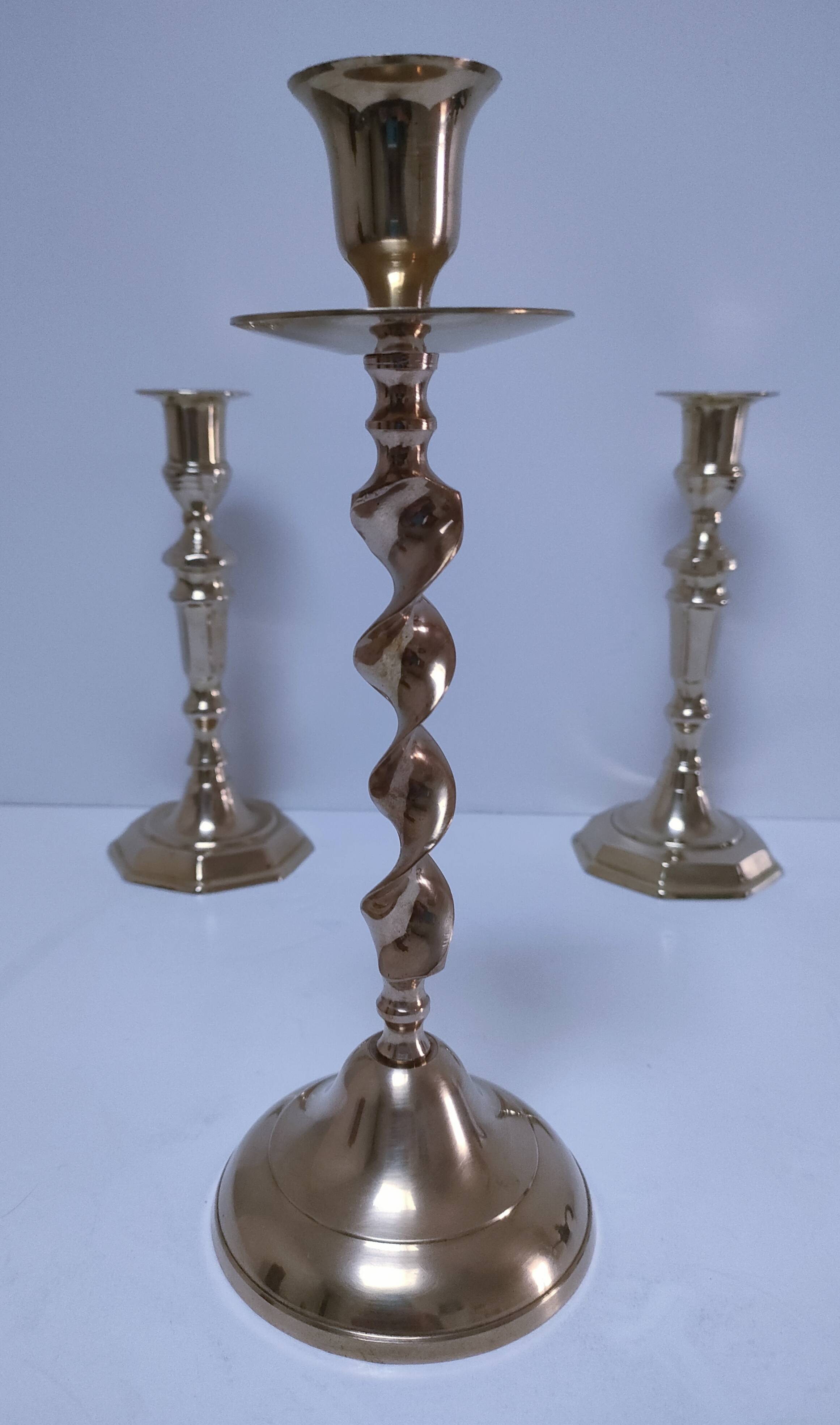 Three vintage solid brass candle holders