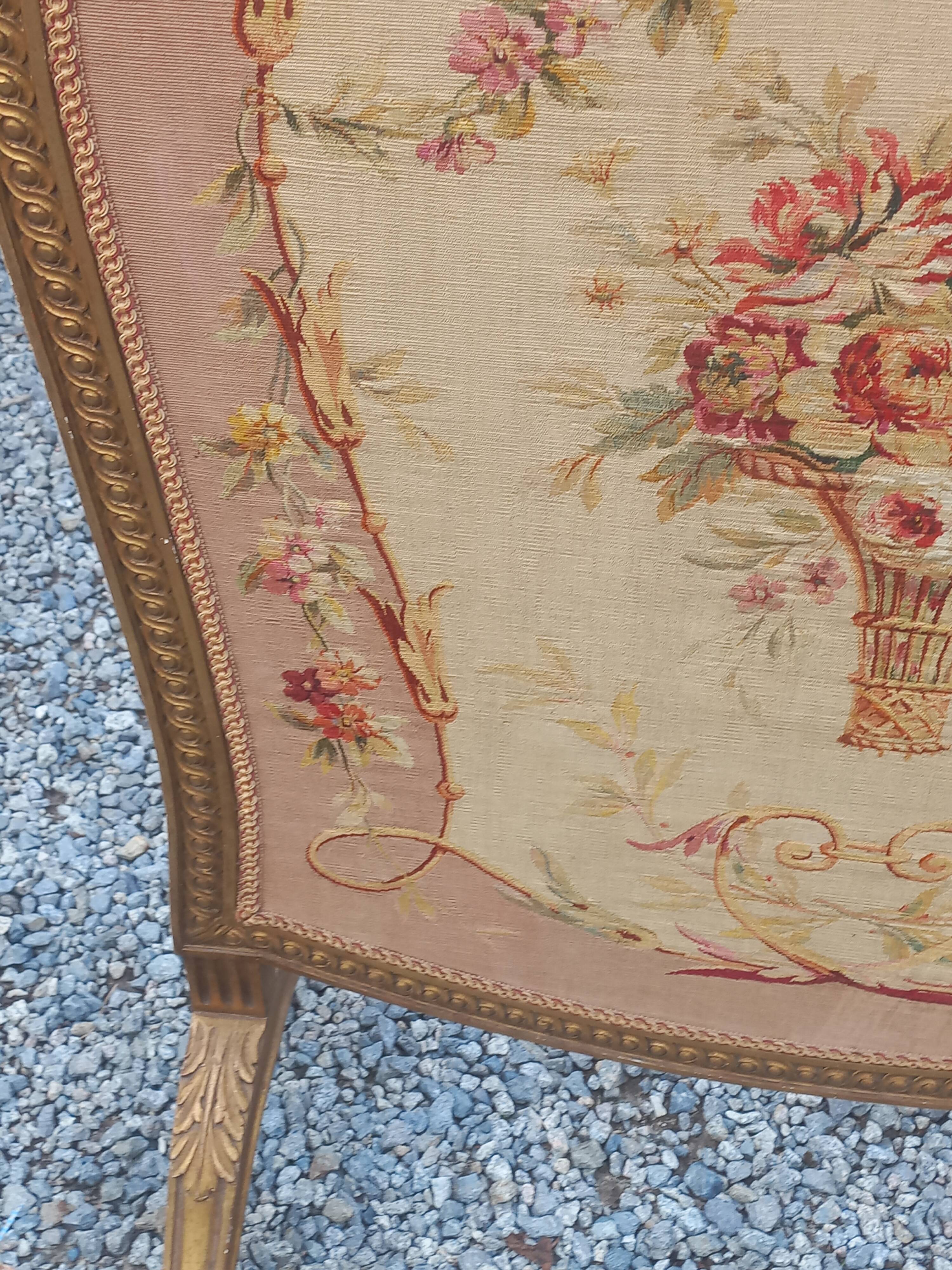 Golden wooden fireplace screen and Aubusson tapestry, 19th century.