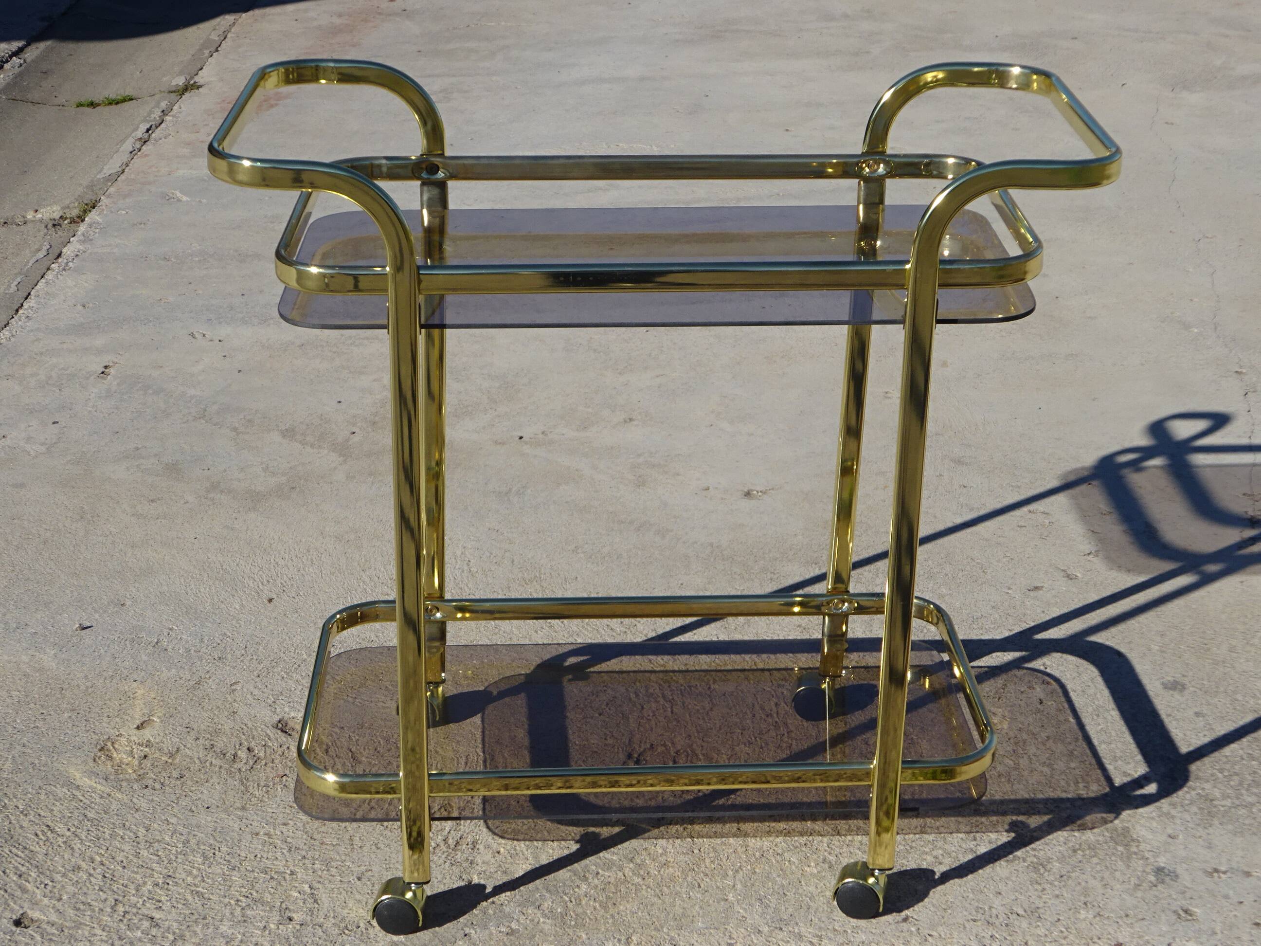 Golden metal and smoked glass dessert table