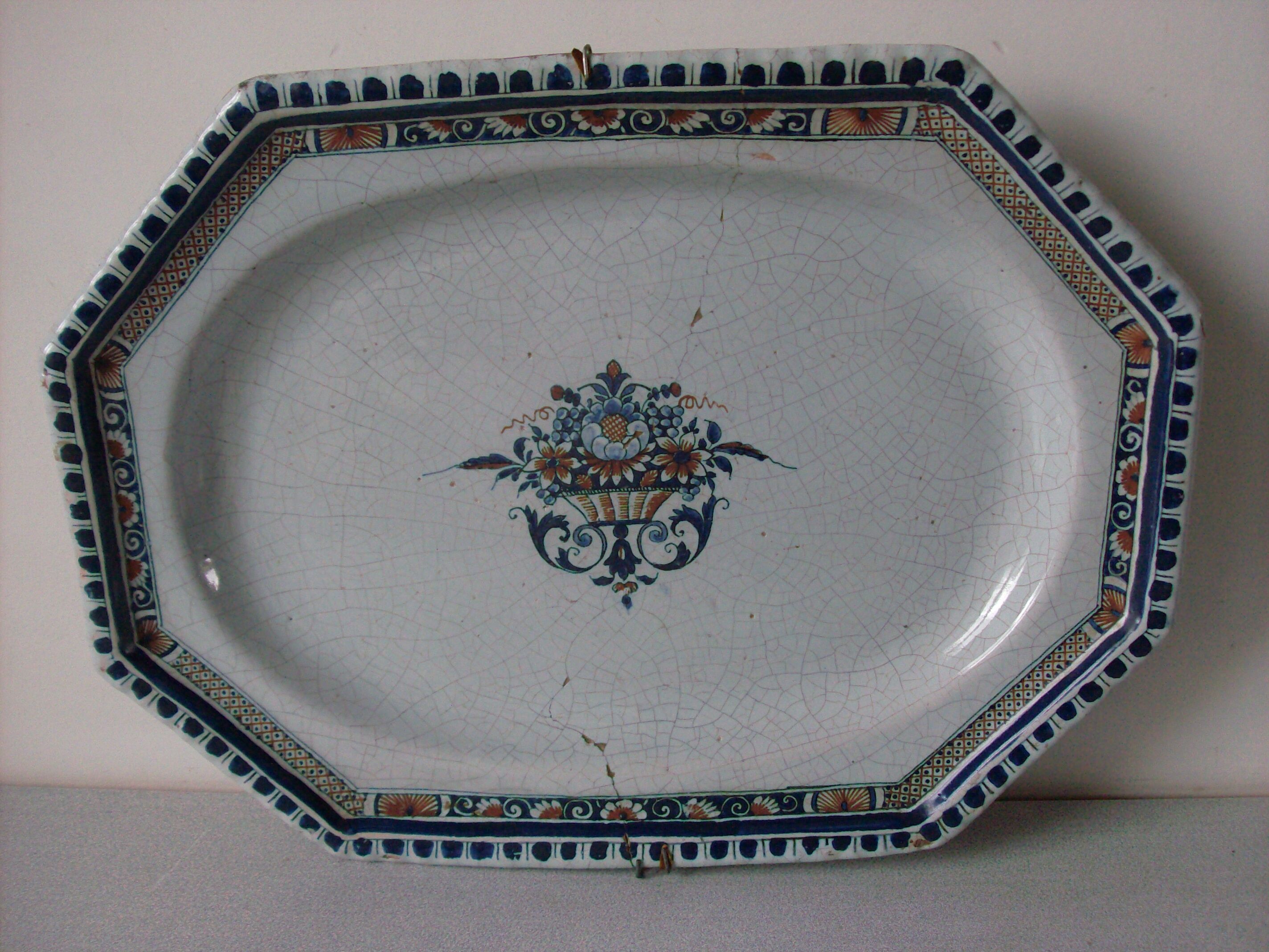 Earthenware dish of Rouen polychrome 18th wall mounting system