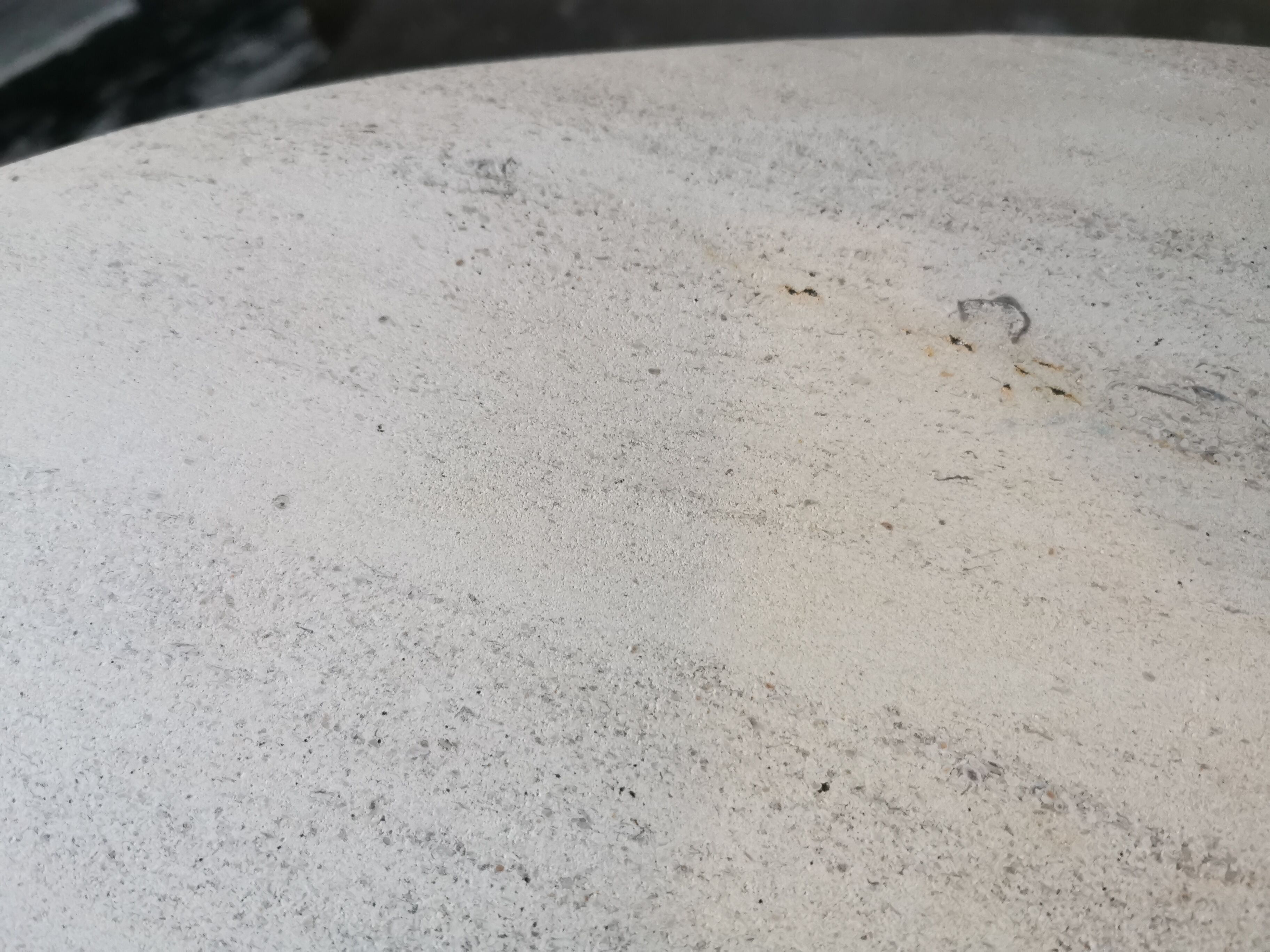 Large oval coffee table in travertine and metal