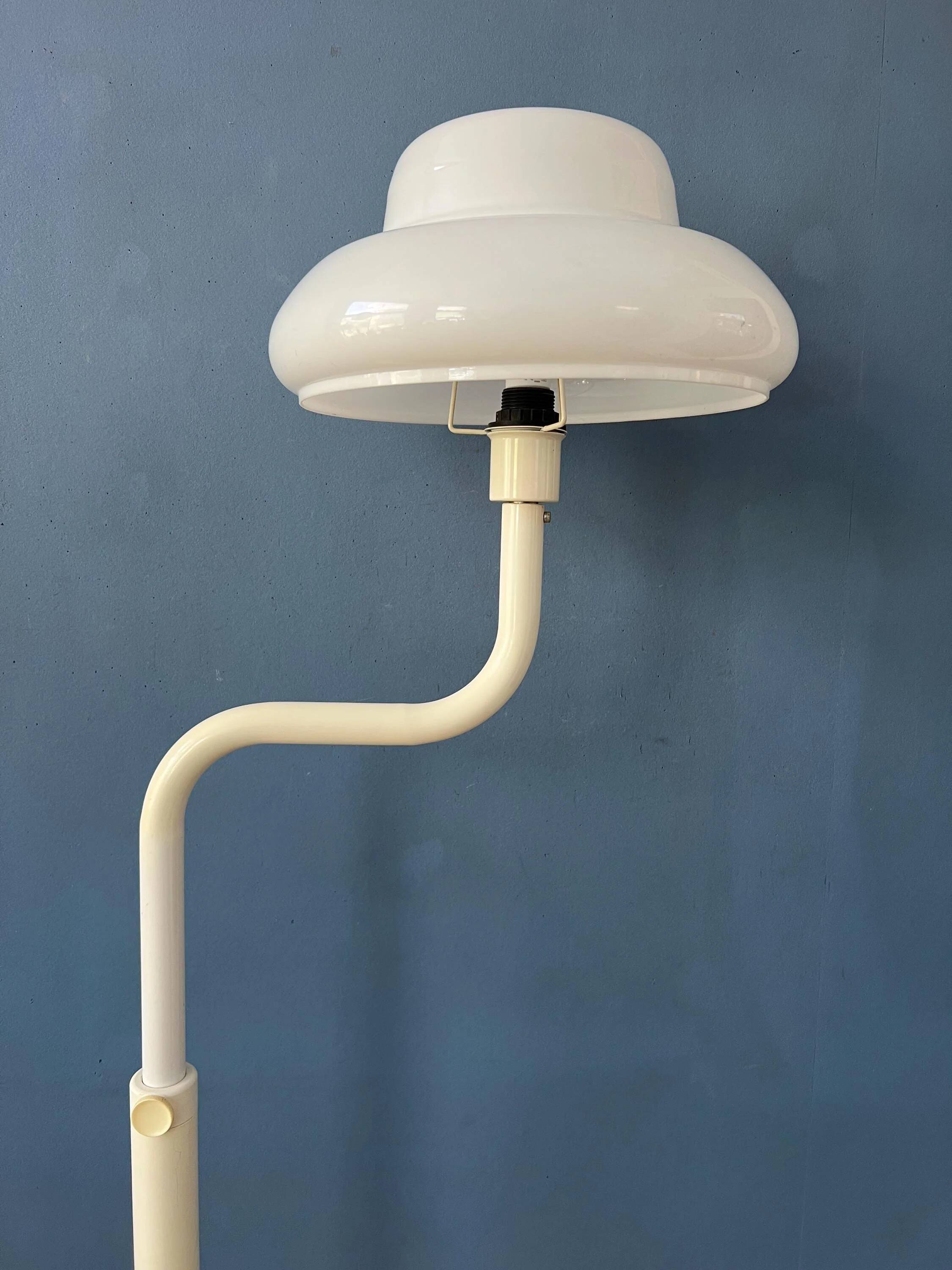 Mid-century mushroom floor lamp with a white plexiglass shade.