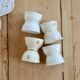4 mismatched vintage diabolo egg cups in earthenware
