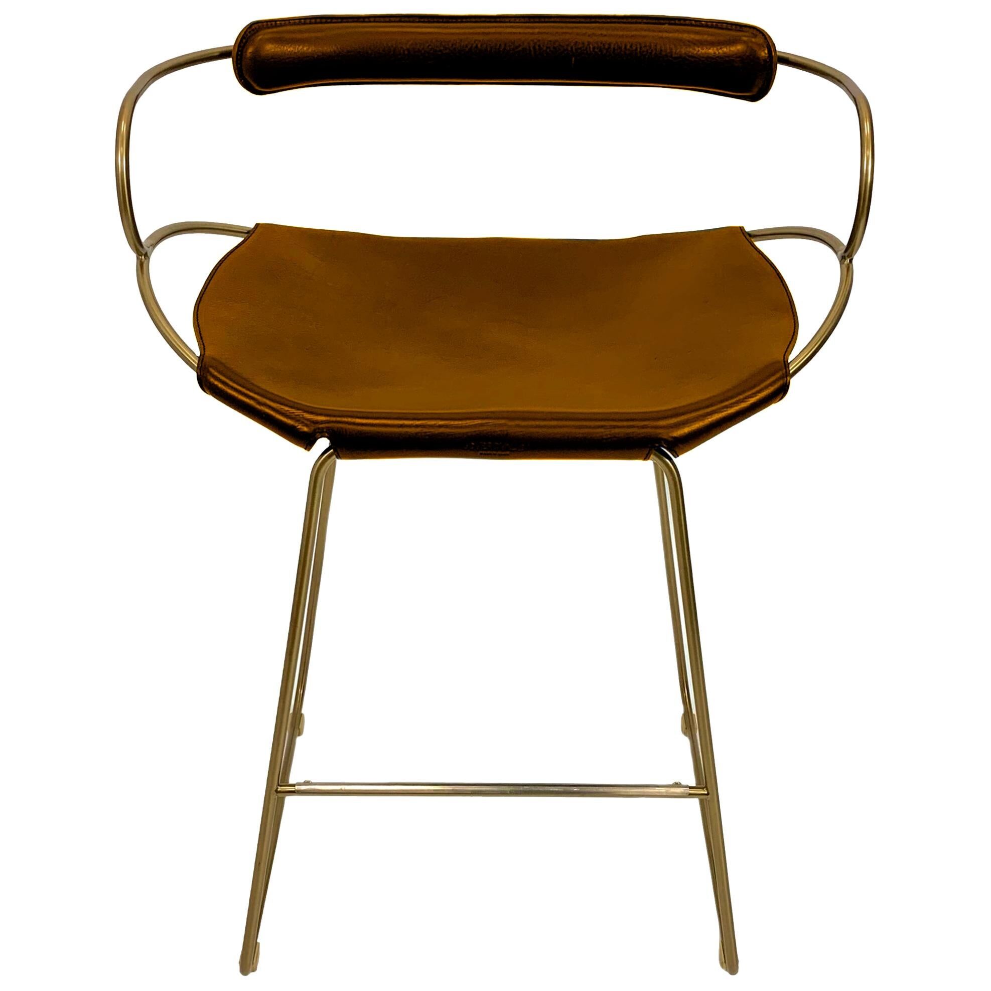 Kitchen bar stool with a brass metal backrest and natural tan tobacco leather.