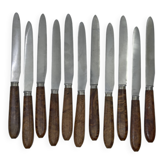 Set of 11 lunch knives with amourette wood handles and filigree decoration.
