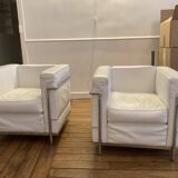 Pair of white leather and chrome armchairs