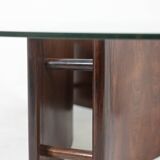 Rosewood coffee table, concave shape. 1970s.