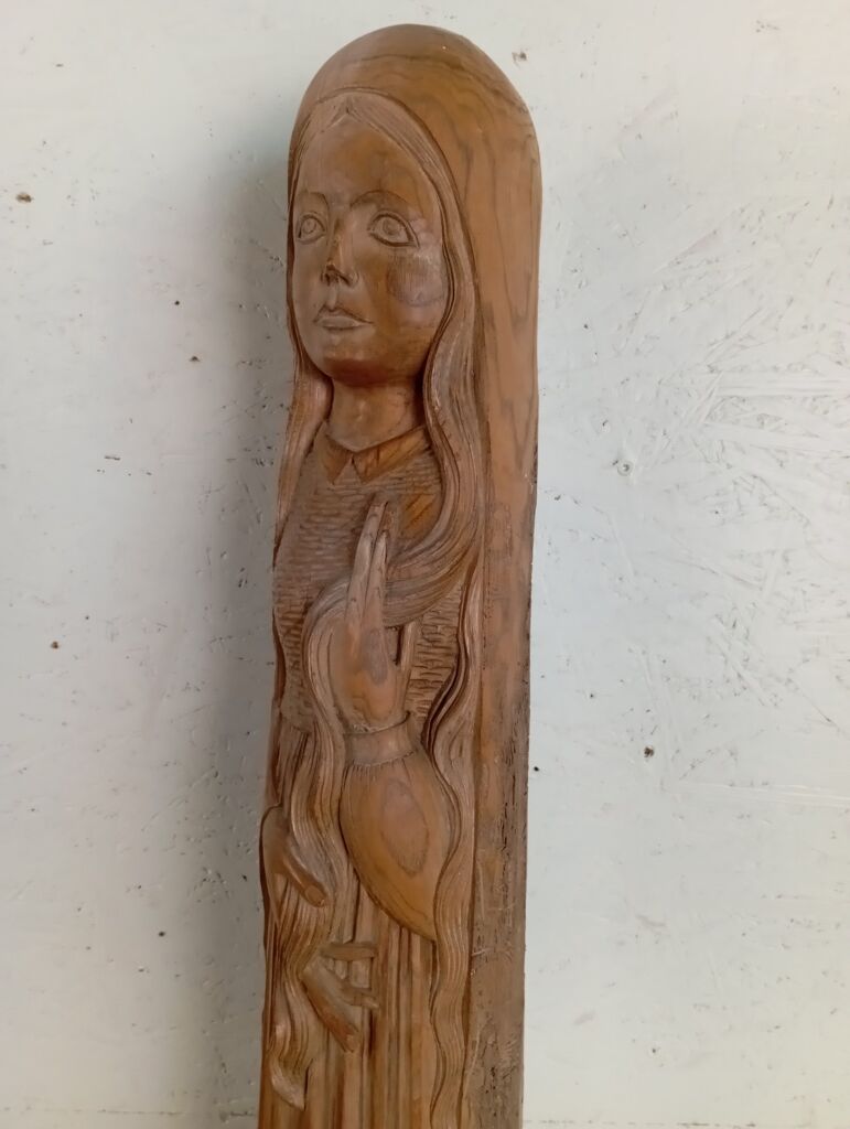 Sculpture of a young woman by Ray Boterf.