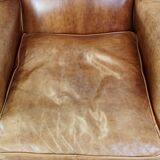 Graceful, stylish, timeless and comfortable wing chair made of cowhide in English style