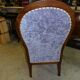 Relaxed Voltaire armchair with walnut racks
