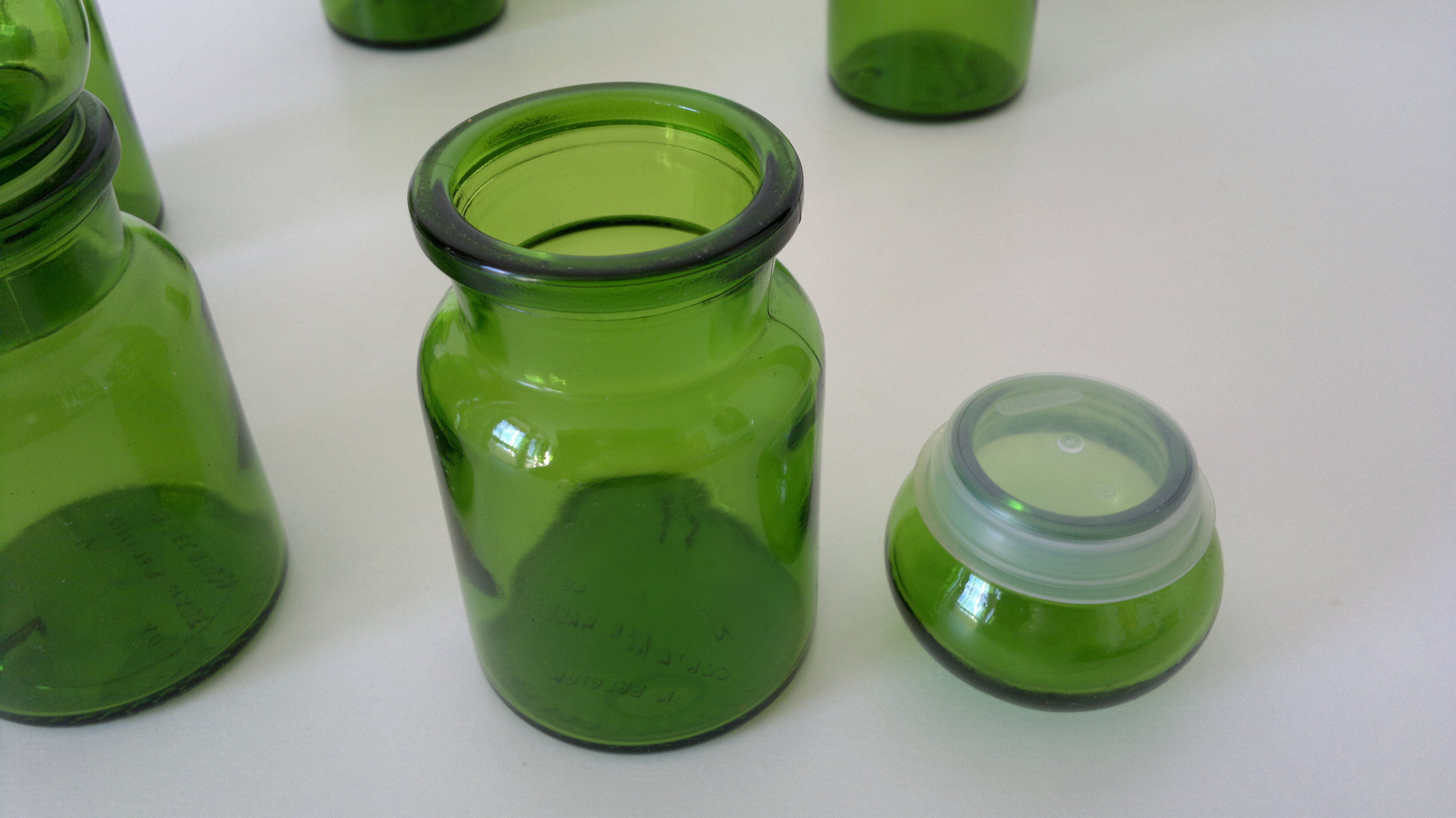 Green vintage set of six jars.
