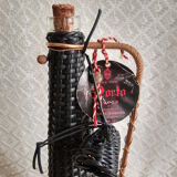 Glass bottle covered with black scoubidou with twisted golden handle - vintage
