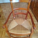 Set of 6 solid wood chairs with high-quality straw seats.