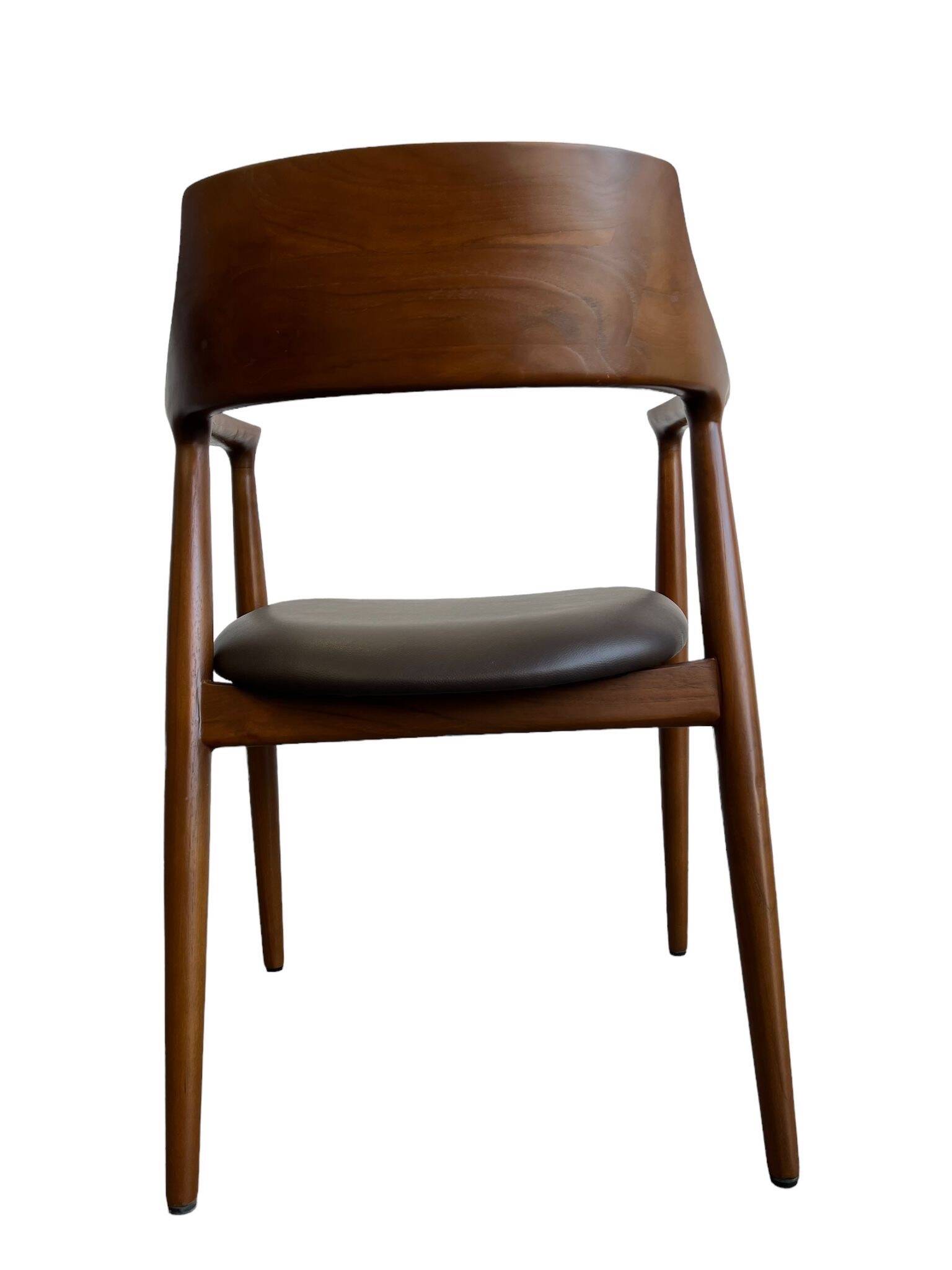 Curved wooden dining chair with brown leather seat