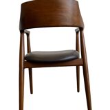 Curved wooden dining chair with brown leather seat