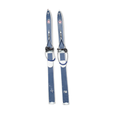 Pair of old children ski ings in blue wood