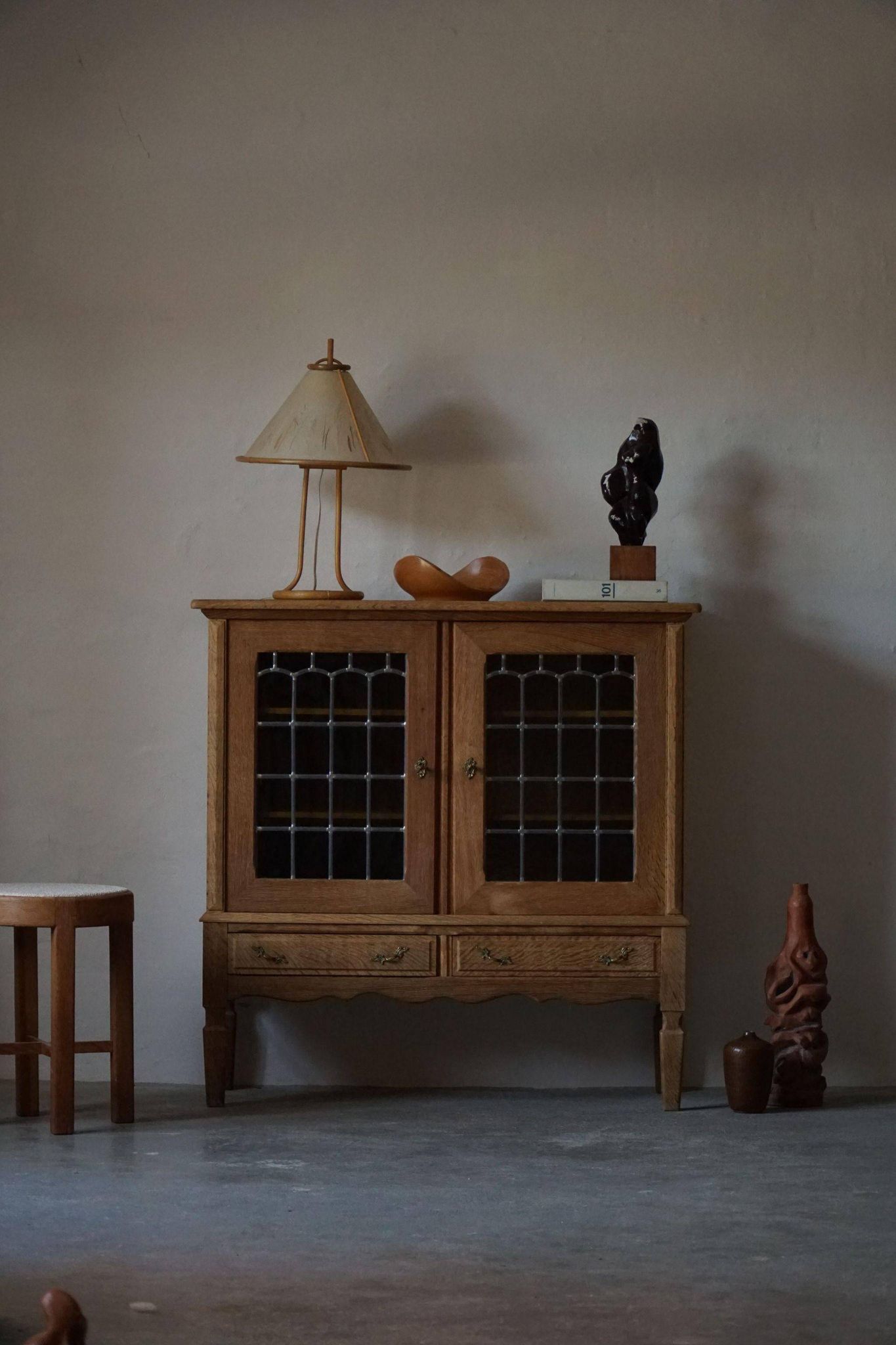 20th-century mid-century solid oak sideboard with glass front, by a Danish cabinetmaker.