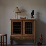 20th-century mid-century solid oak sideboard with glass front, by a Danish cabinetmaker.