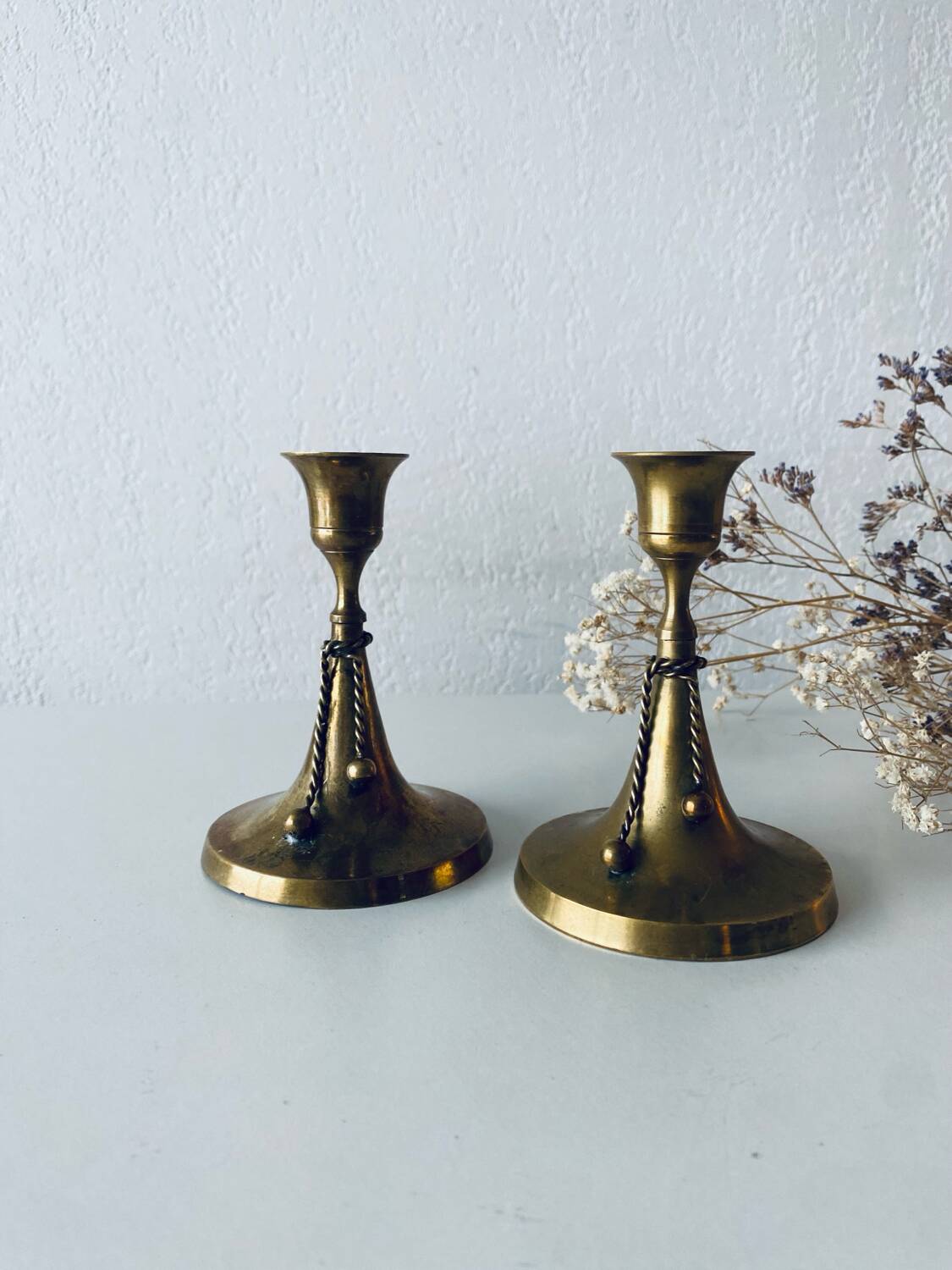 Pair of brass cord candle holders