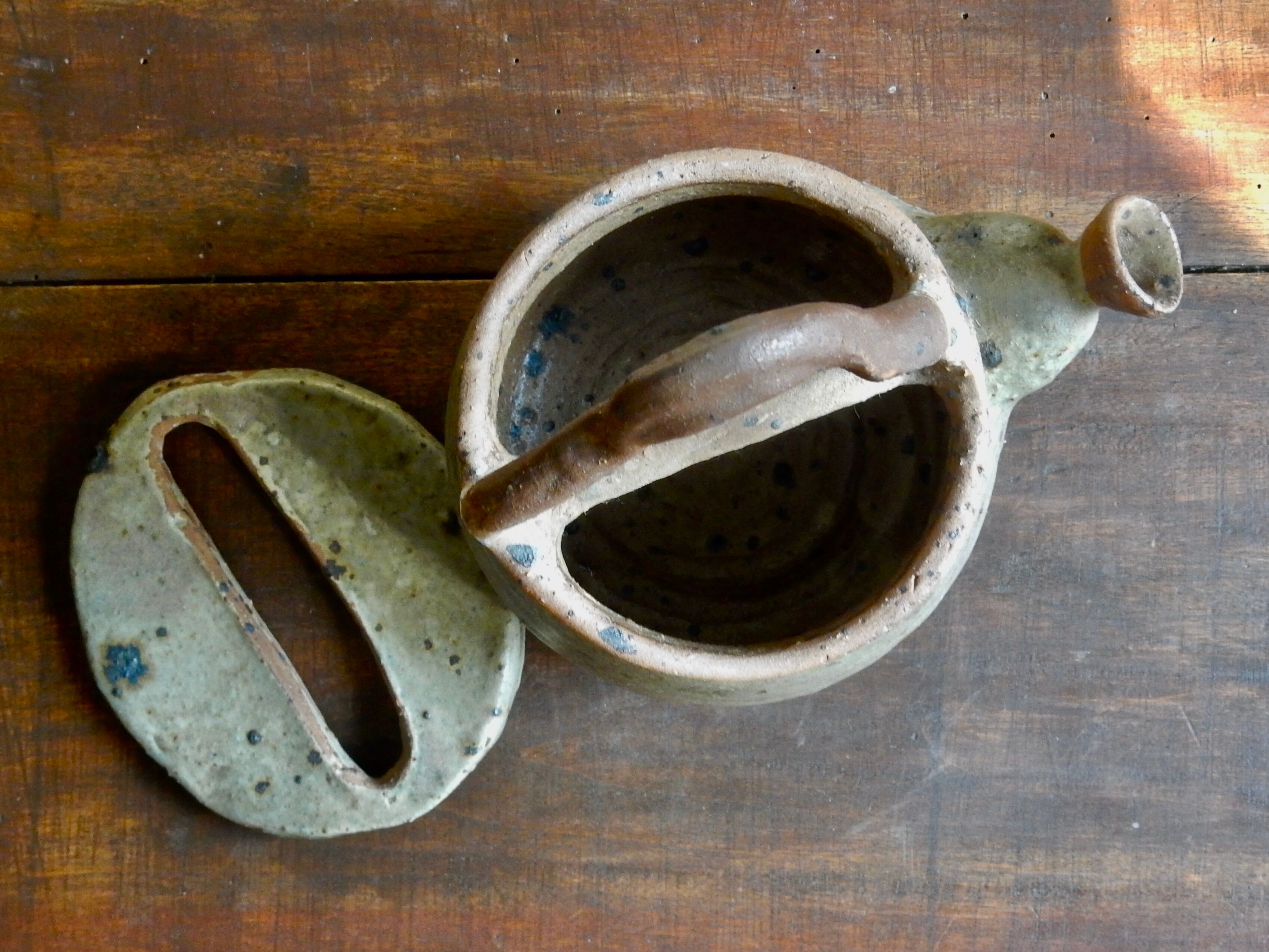 Homemade teapot in pyrity sandstone