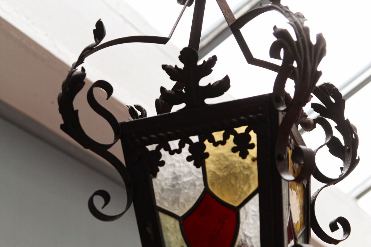 Wrought iron lantern and stained glass windows